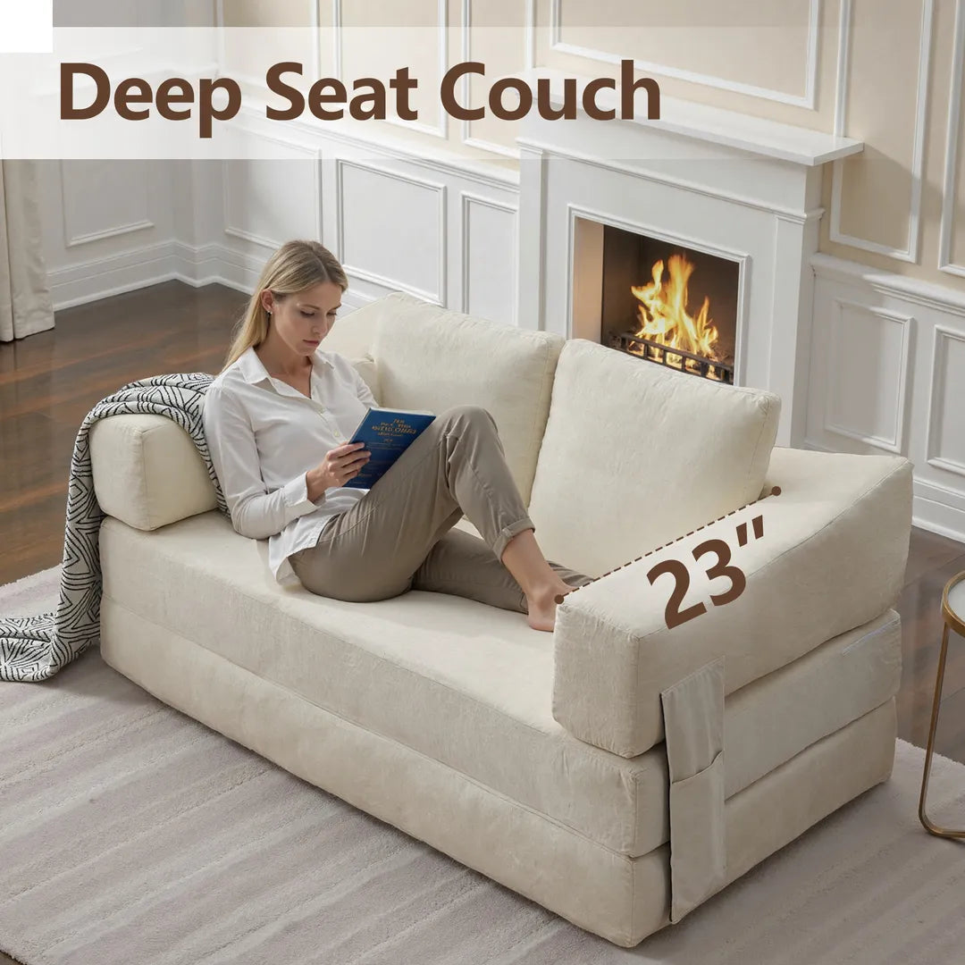 Girl sitting on the deep seat couch and reading